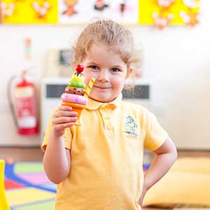 child with toy ice-cream